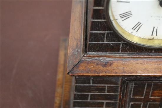 A late Victorian carved oak Lighthouse  clock barometer by Frank Flower of St James